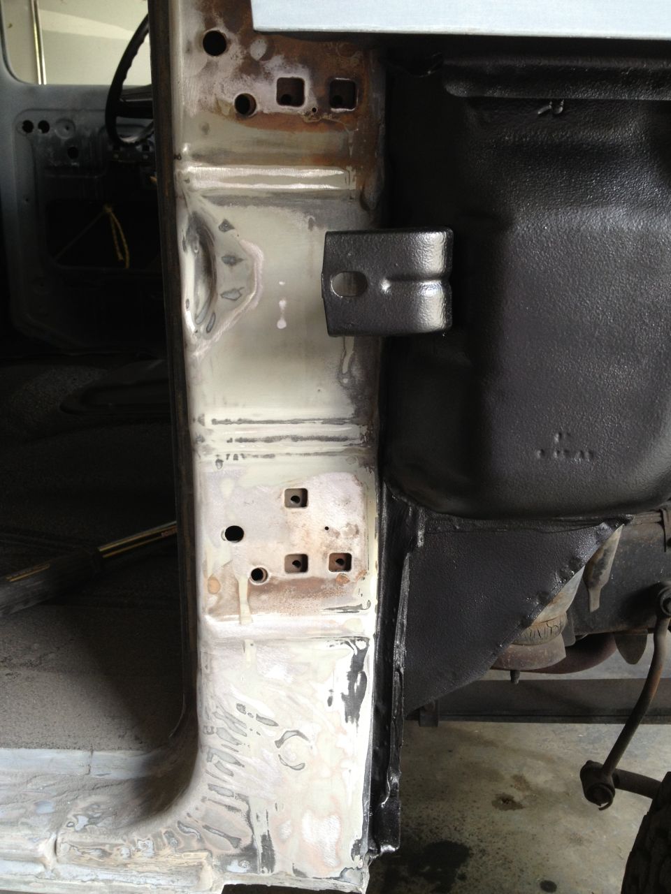 1979 Ford F-350 door jamb with primer and some rust spots