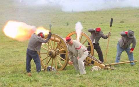 1979 Ford Bronco - A historical reenactment captures the moment a cannon is fired, complete with smoke and a bright flash.