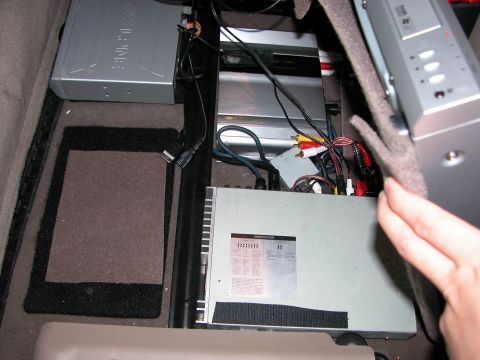 2002 Ford Excursion - Alpine Brain and Dolby Digital decoder. Wires run for PS2.