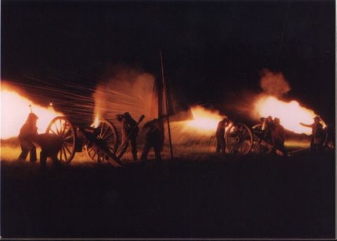 1979 Ford Bronco - Cannons are fired at night, illuminating the scene with bright flashes and smoke.