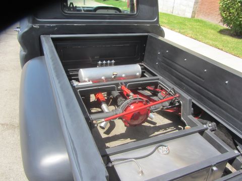 1968 Ford Mustang - Custom pickup truck bed with air suspension components and a modified rear axle.