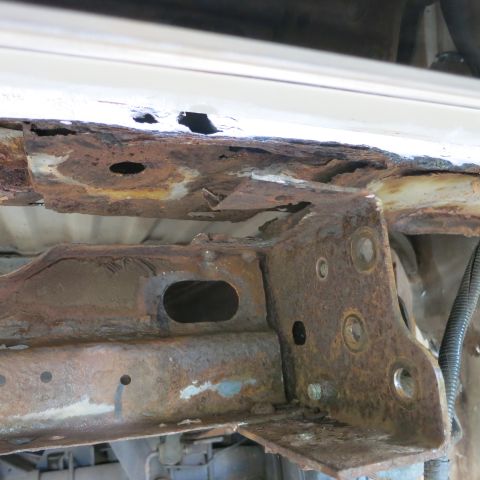 1995 Ford Bronco - The vehicle's frame shows extensive rust damage, indicating potential structural weakness.