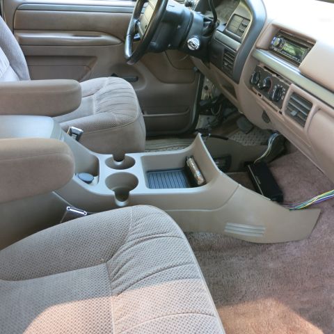 1995 Ford Bronco - Interior view of a 1990s SUV, showing the seats, dashboard, and center console.