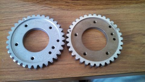 1950 Ford Wagon - Two gears are shown side-by-side on a wooden surface.