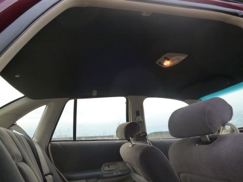 1992 Ford Crown Victoria - Interior view of a 1992 Ford Crown Victoria, focusing on the headliner and rear seating area.