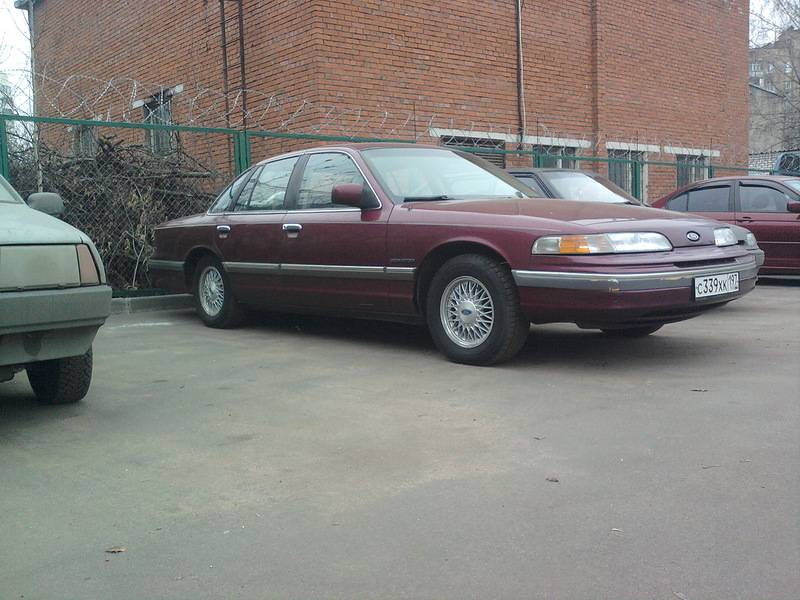 Maroon 1992 Ford Crown Victoria parked on a lot