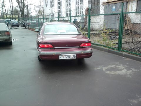 1992 Ford Crown Victoria - Rear view of a maroon 1992 Ford Crown Victoria with a license plate.
