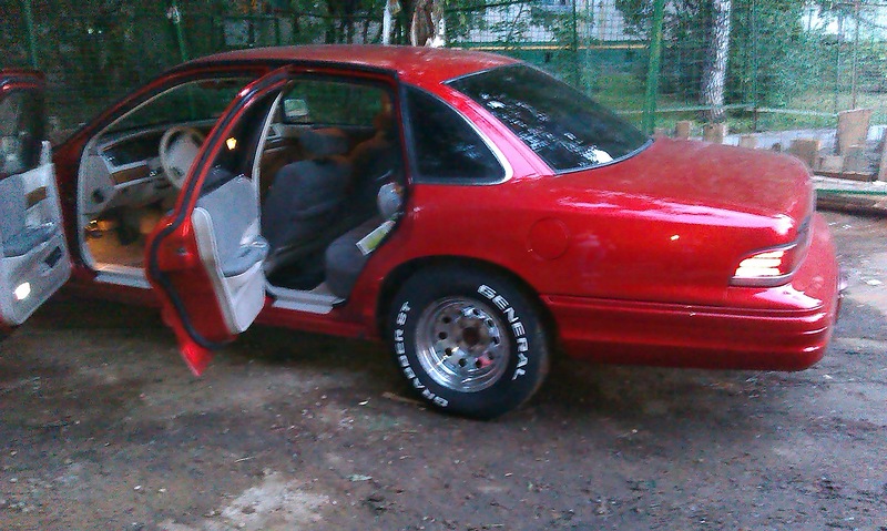 1992 Ford Crown Victoria sedan, red, with all four doors open