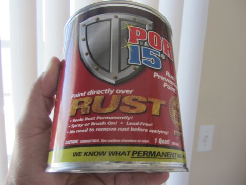 1964 Ford Ranchero - POR-15 rust preventive paint can is held in a hand.