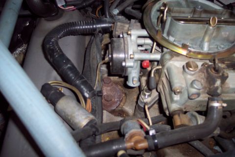 1991 Ford LTD Crown Victoria - Engine bay detail showing a carburetor and associated hoses and wiring.