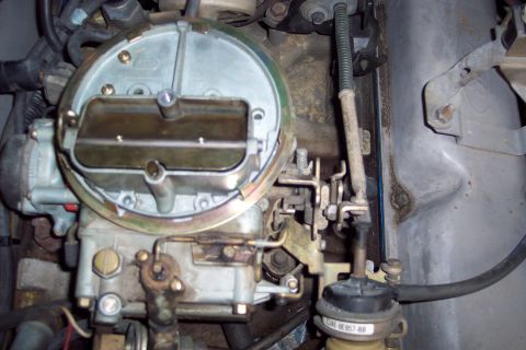 1991 Ford LTD Crown Victoria - Close-up of a Ford carburetor, showing the part number 248E-9E957-BB.