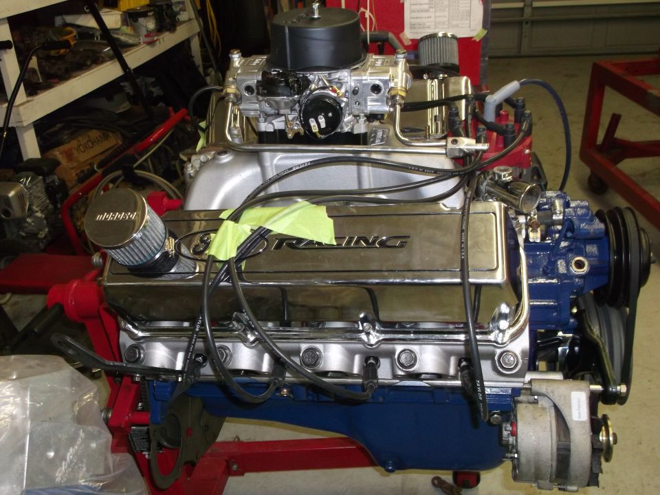 Chrome valve covers with '351 RACING' text, carburetor, and blue engine block
