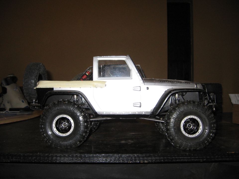 RC Jeep Wrangler with large tires and a spare tire on the back