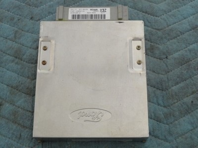 1994 Ford Bronco - A silver Ford engine control module is shown from the top, with visible text and a Ford logo.