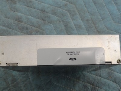 1994 Ford Bronco - A Ford electronic module is shown with a warranty sticker indicating it should not be opened.