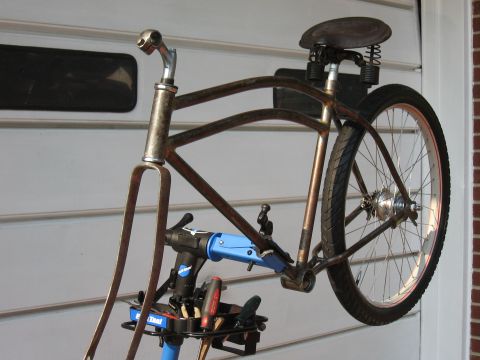 1994 Ford Bronco - Bicycle frame and repair stand with tools visible.