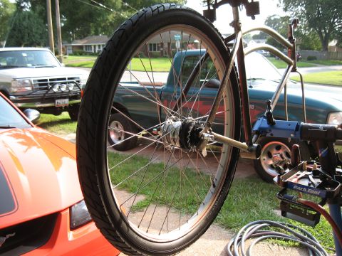 1994 Ford Bronco - A bicycle is being worked on, with other vehicles visible in the driveway.