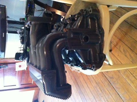 1992 Ford Bronco - Engine intake manifold with curved runners is shown, likely a part for a vehicle.