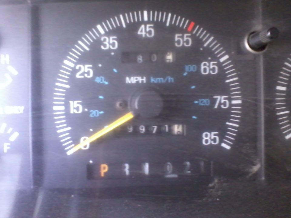 1991 Ford Bronco speedometer showing 80 mph and odometer reading 99711 miles