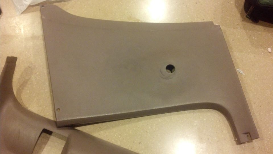 Tan interior door panel with a circular cutout