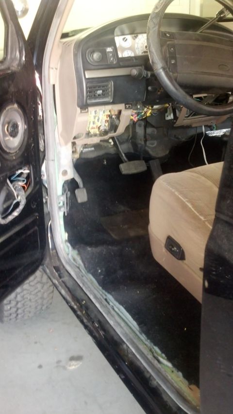 1995 Ford Bronco - The interior of a 1995 Ford Bronco, with the driver's seat and dashboard visible.