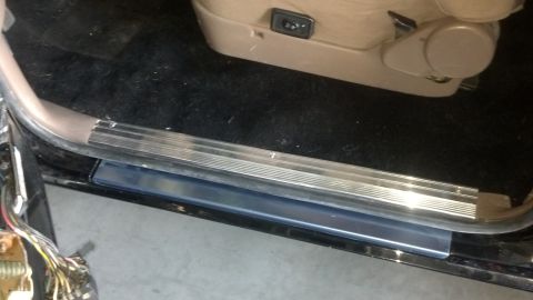 1995 Ford Bronco - Close-up view of the interior door sill and seat control panel in a 1995 Ford Bronco.