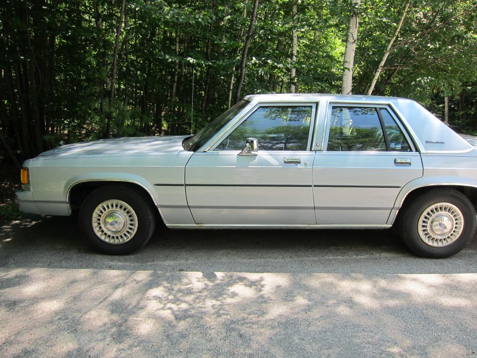 Silver 1991 Ford Crown Victoria LTD sedan, side view