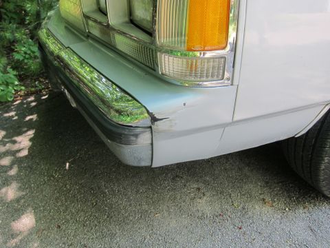 1991 Ford LTD Crown Victoria - Front corner view of a 1991 Ford Crown Victoria LTD showing bumper damage.