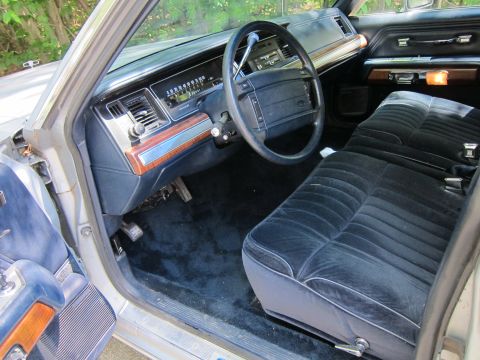 1991 Ford LTD Crown Victoria - Interior view of a 1991 Ford Crown Victoria LTD, velour seats and the dashboard.