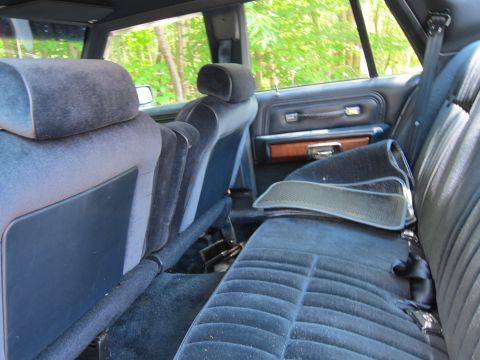 1991 Ford LTD Crown Victoria - Interior view of a 1991 Ford Crown Victoria LTD, showing the rear seating area and door panel.