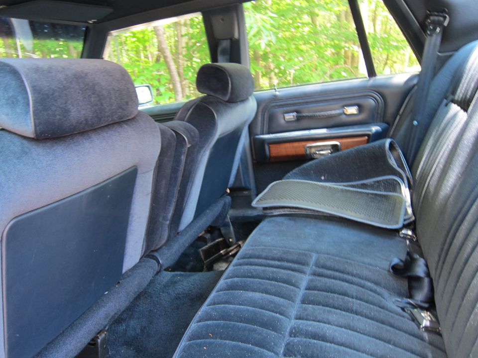 1991 Ford Crown Victoria LTD interior with blue velour seats and wood trim door panel