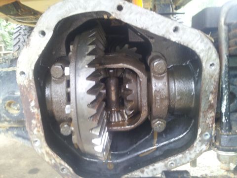 1988 Ford Bronco - The internal workings of a vehicle's differential are exposed, showing the gears and housing.