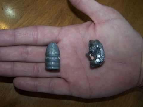 1979 Ford Bronco - A comparison of a fired and unfired bullet is shown in a hand.