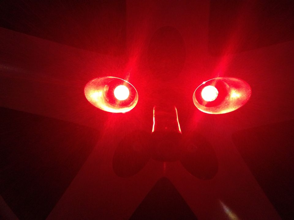 Red third brake light with two illuminated bulbs, viewed from below