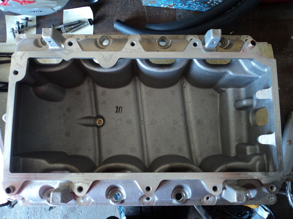 Engine intake manifold with '10' cast into it