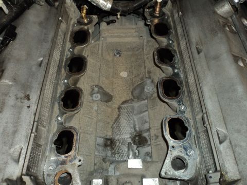 2004 Mercury Grand Marquis - Close-up view of an engine's intake manifold, showing the ports for cylinder intake.