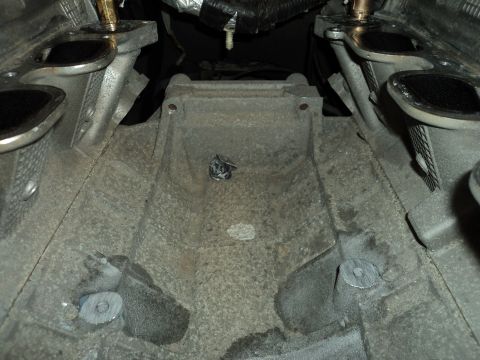 2004 Mercury Grand Marquis - Close-up view of an engine block, showing exhaust manifold connections and mounting points.