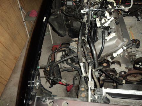 2004 Mercury Grand Marquis - The engine bay is shown with various components and wiring harnesses disconnected.