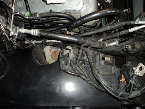 2004 Mercury Grand Marquis - Close-up view of engine bay components, including hoses and wiring harnesses.