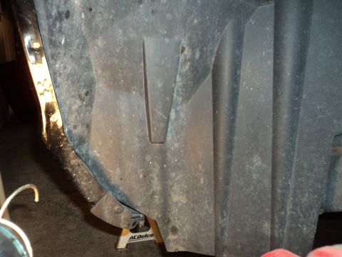 2004 Mercury Grand Marquis - Close-up view of a vehicle's inner fender liner, with the Supermotors.net logo visible at the bottom right.