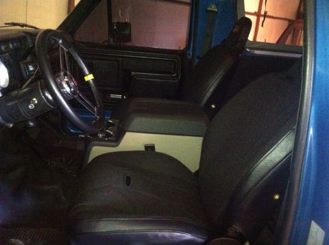 1982 Ford Bronco - Steering wheel and seat upgrade. Mastercraft suspension seats and F250 center console.