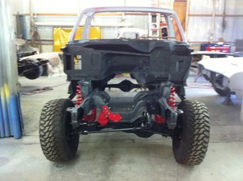 1982 Ford Bronco - The chassis of a truck, possibly a Ford Bronco, is shown in a workshop during restoration.