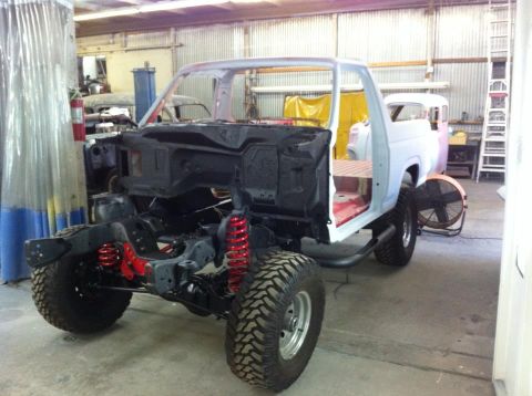 1982 Ford Bronco - Ford Bronco body in a workshop, stripped down and ready for restoration work.