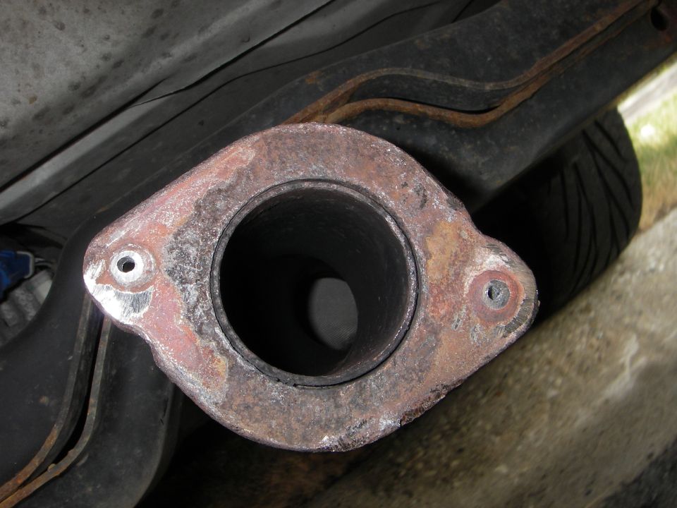 pilot holes, then drill progressively larger holes until all the offending material is gone