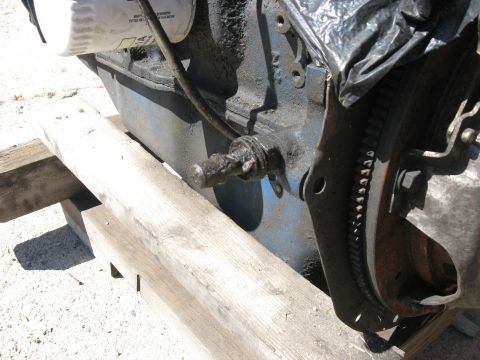 1981 Ford Bronco - Close-up view of an engine oil filter and a flywheel, likely from a Ford vehicle.