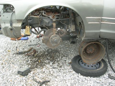 1994 Ford Crown Victoria - Someone had already snagged the caliper brackets, so a lot of the work was already done, including loosening the wheelwells. I found the br…