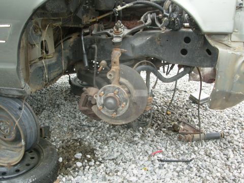 1994 Ford Crown Victoria - Someone had already snagged the caliper brackets, so a lot of the work was already done, including loosening the wheelwells. I found the br…