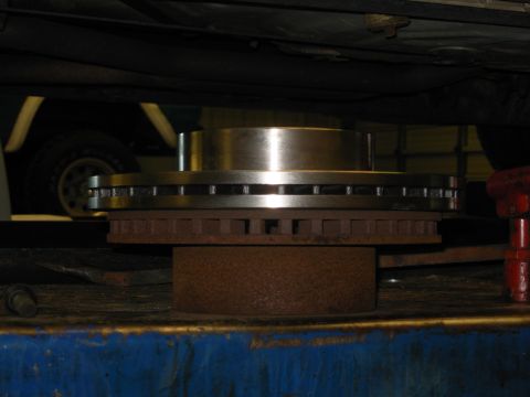 1994 Ford Crown Victoria - Not the best pic, but the new rotors obviously have a larger diameter, and a smaller hat. Somehow I missed taking pics of them, but the pad…