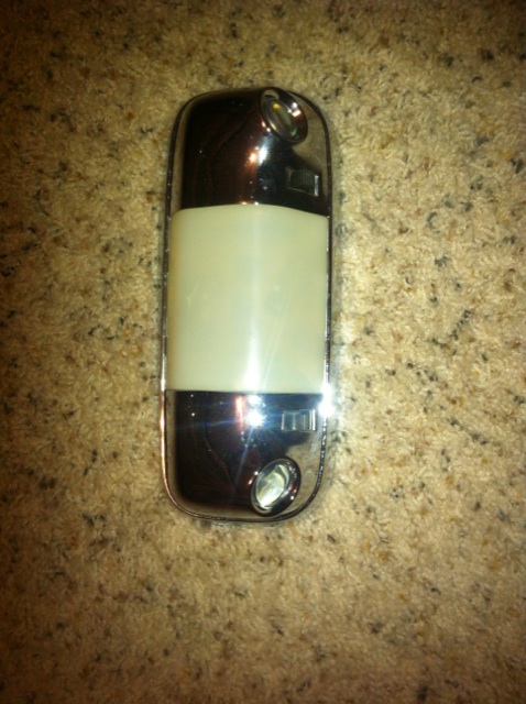 1982 Ford Bronco - Interior dome light assembly with chrome trim and a frosted lens.