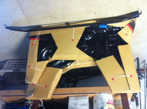 1982 Ford Bronco - A car door is packaged for transport or storage, with protective cardboard and ties.